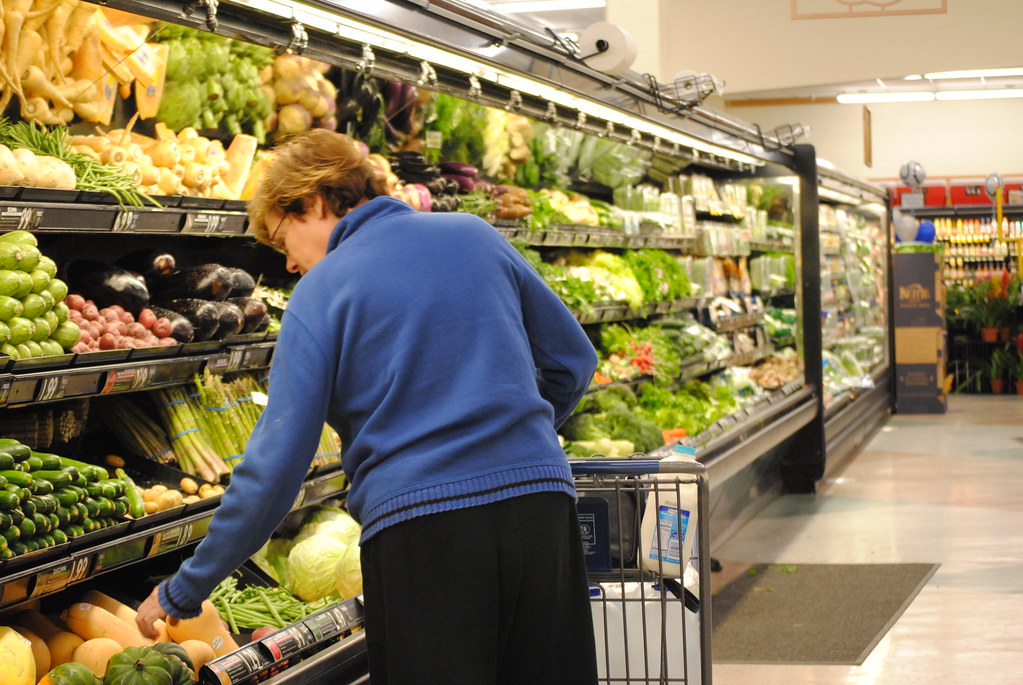 Supermarket produce aisle with broad category variety